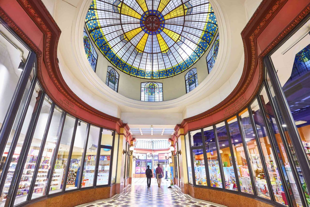 Stunning stained glass dome in an indoor shopping area.